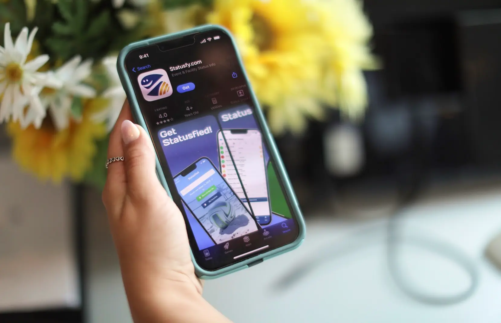 person downloading statusfy app on phone