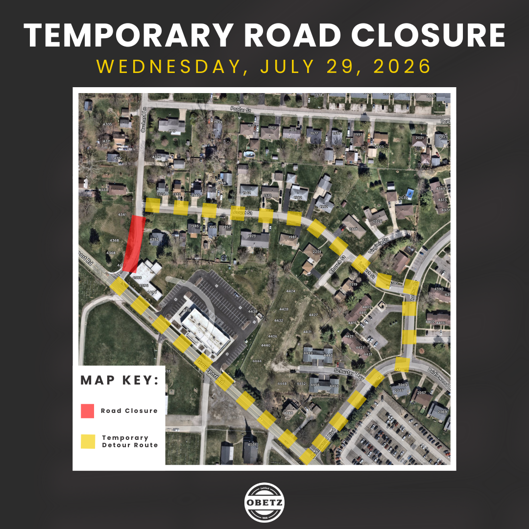 Poster announcing a temporary road closure on Wednesday, July 29, 2026, with an aerial map showing a red closed segment and a yellow detour route; map key notes red = road closure, yellow = detour; OBETZ logo at bottom.