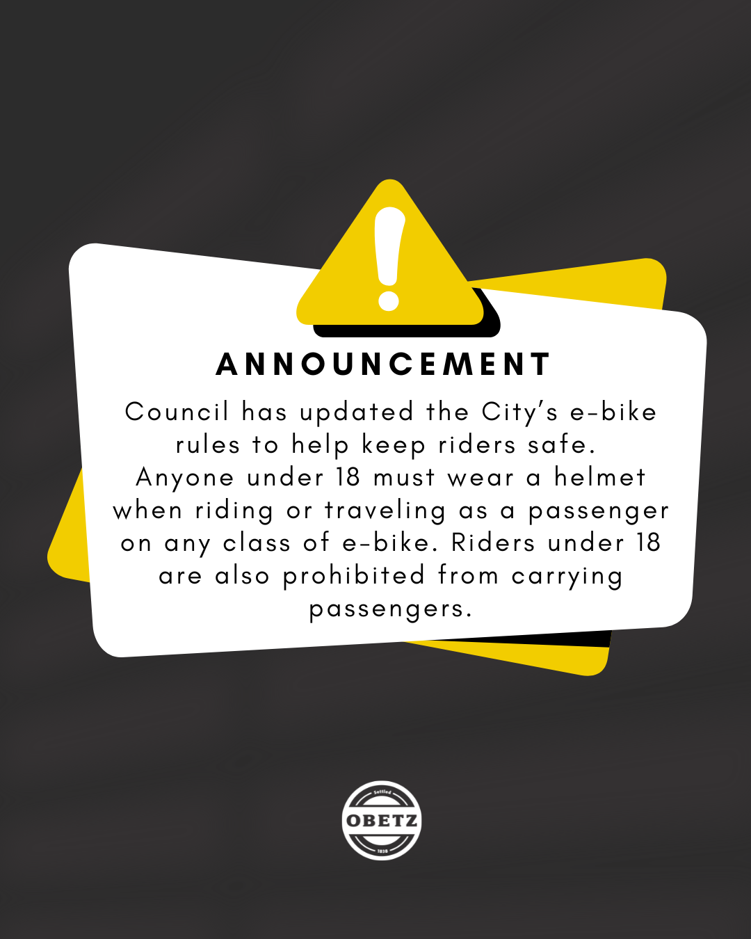 ebike Announcement poster: under-18 helmet rule for e-bikes; riders under 18 may not carry passengers; Obetz logo.